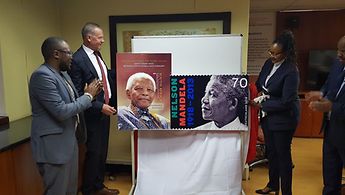 Deputy Ambassador Streicher unveiling the stamps in South Africa